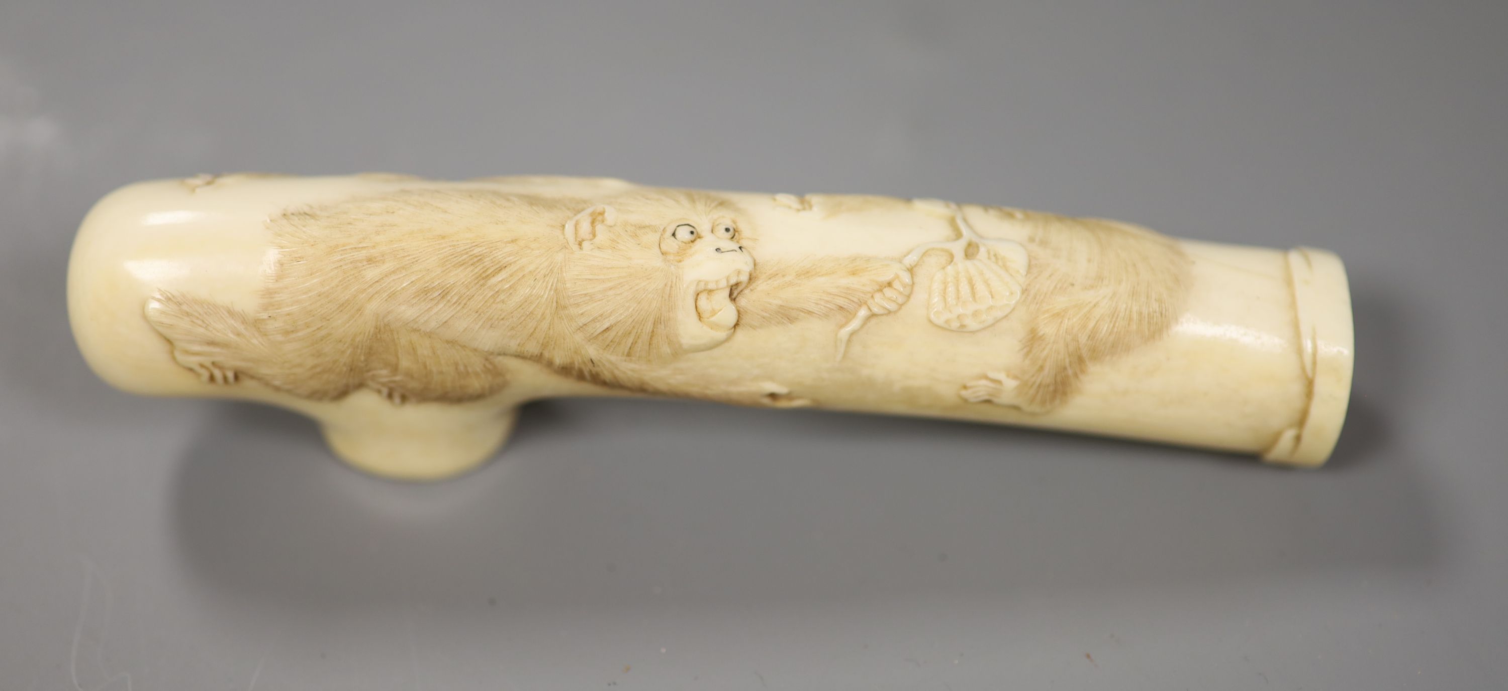 A Japanese Meiji period carved ivory cane handle